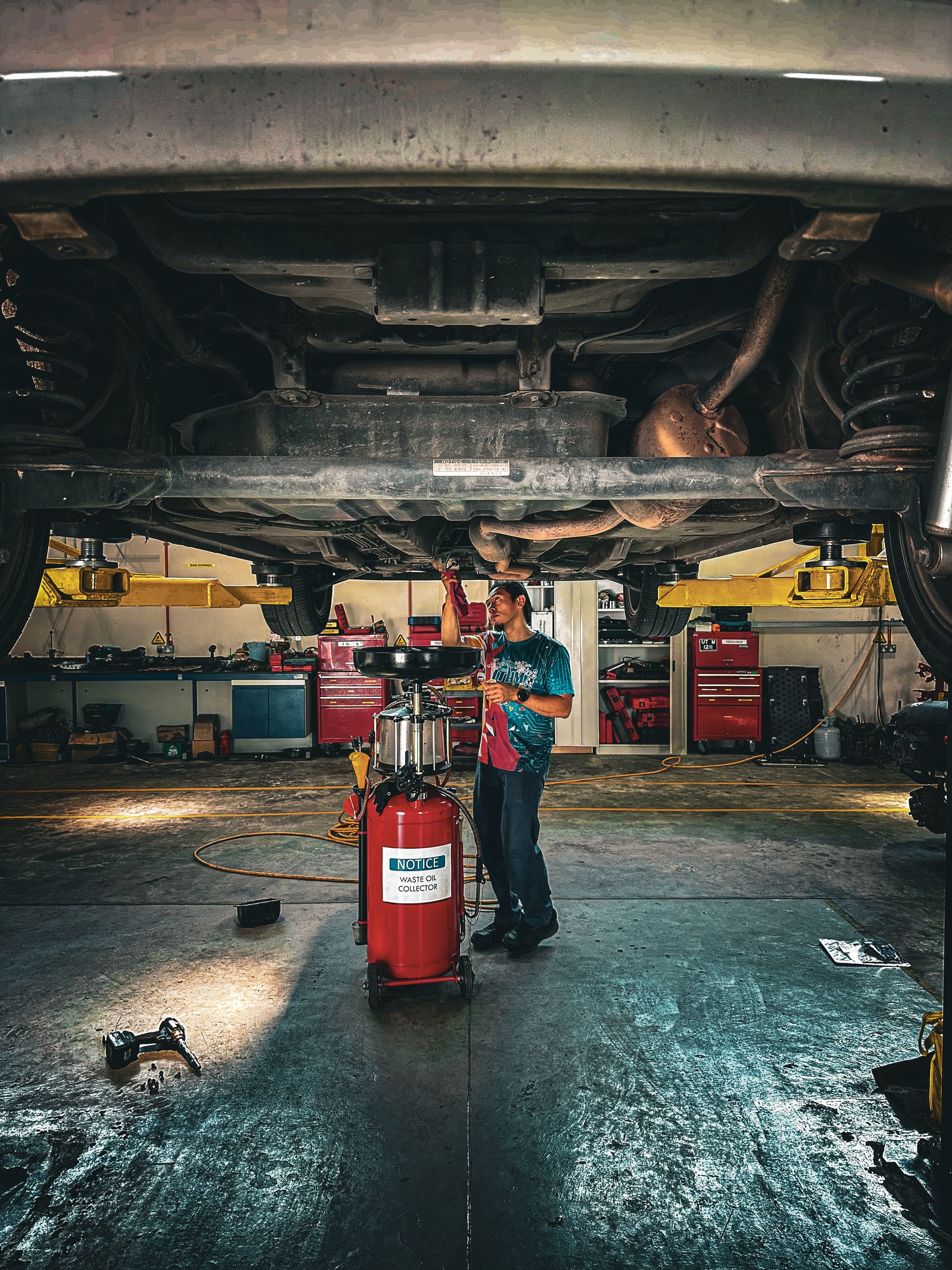 Experienced auto mechanic working on vehicle repair